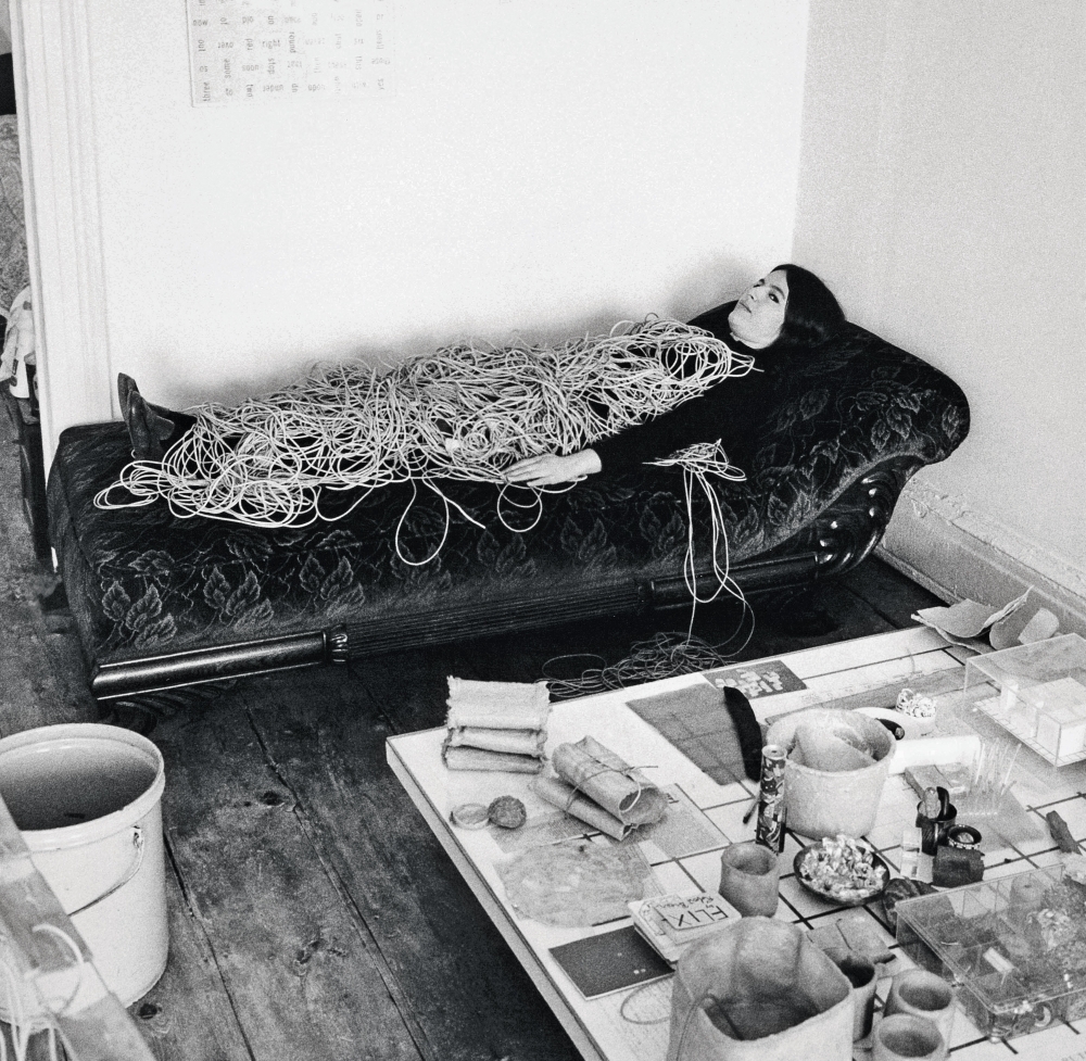 [FIG. 1]
Eva Hesse in her New York studio in 1968, photo by Hermann Landshoff. Image: bpk Bildagentur / M&uuml;nchner Stadtmuseum, Munich / Hermann Landshoff / Art Resource, NY.